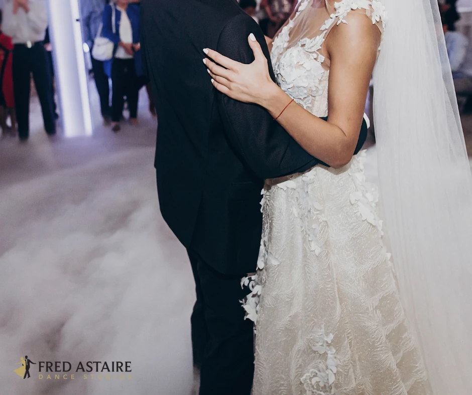 a man and woman dancing to wedding first dance songs