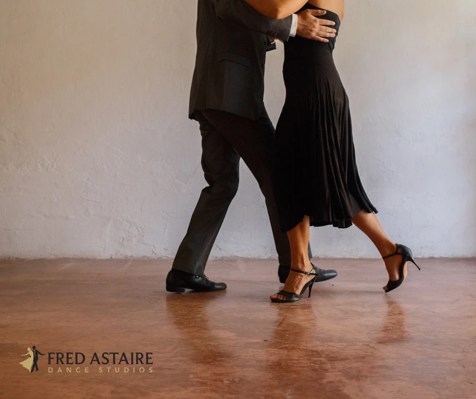 Ballroom dancers demonstrating International Standard and Latin dance movement and footwork