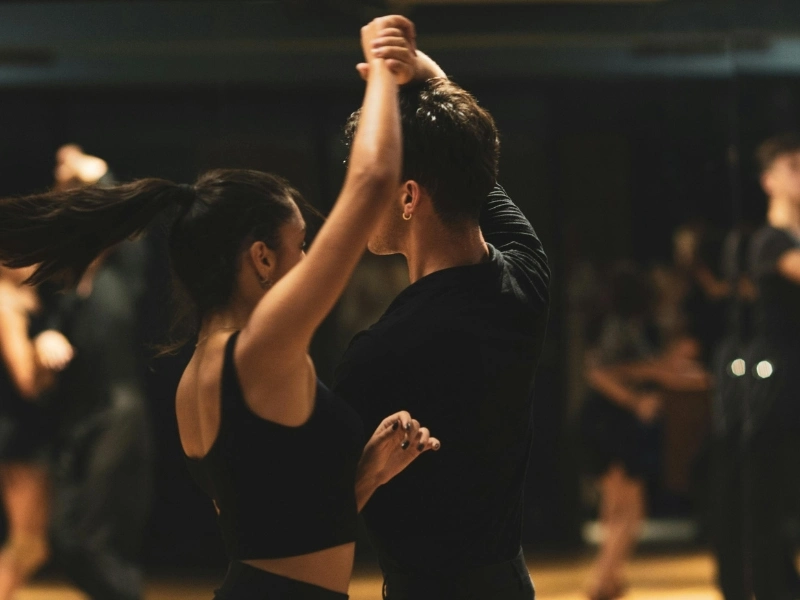 young couple taking group dance classes in Raleigh.