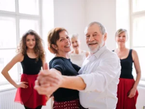 Dance instructors and senior couple taking private dance lessons in North Raleigh, NC.