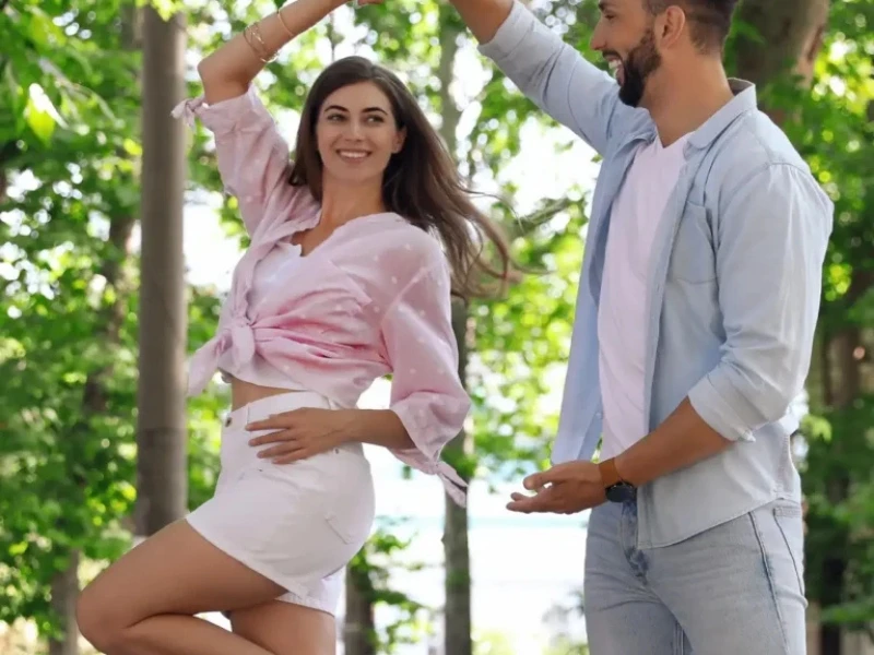 couple dances outside. Image complements the blog titled Why a Dance Lessons Anniversary Gift Wins Every Time.