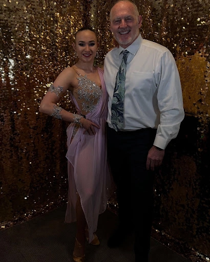 A charming dance couple posing for a camera before taking their Waltz dance lessons in Saratoga Springs.