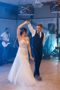 A bride and groom practice a choreographed dance at their wedding reception, highlighting the question, What if I’m Preparing for a Wedding?