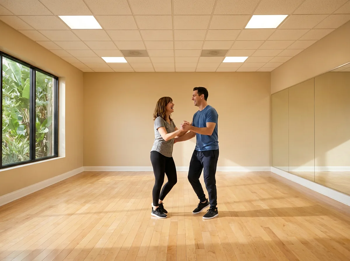 Beginner learning mambo basics with an instructor in Solana Beach