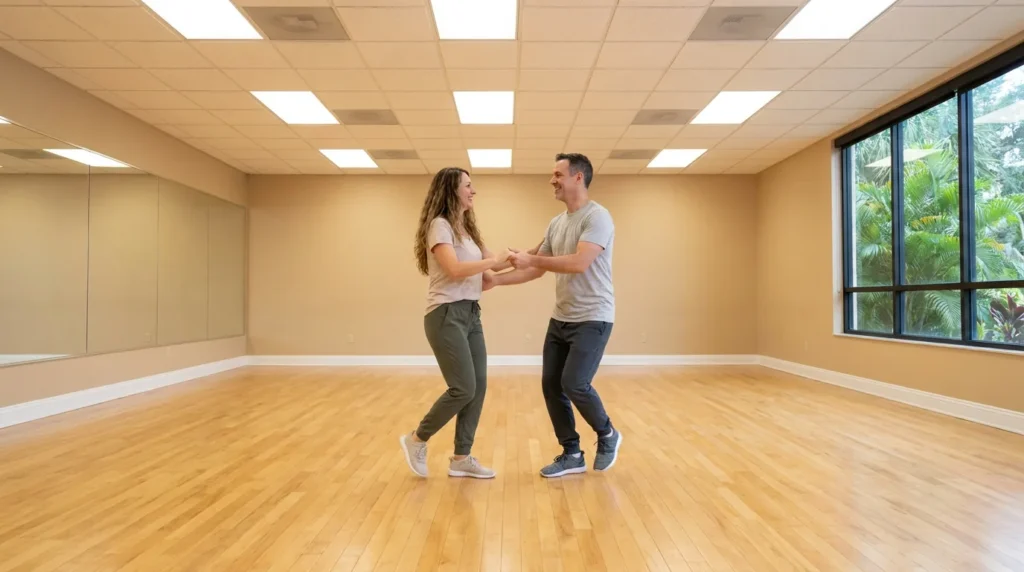 Couple dancing hustle in a Solana Beach studio