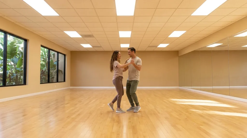 Couple dancing a nightclub social style in a Solana Beach studio