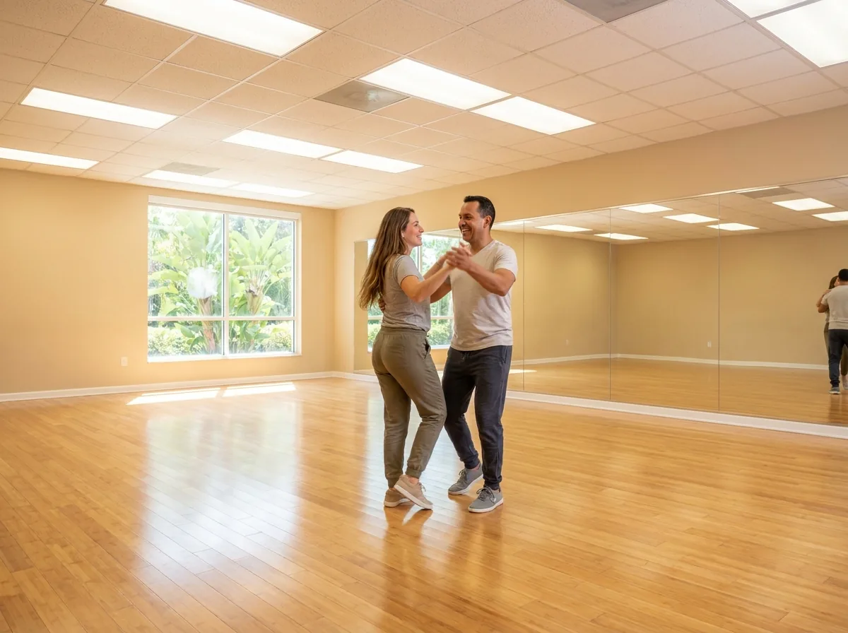Instructor demonstrating salsa technique to a student in Solana Beach