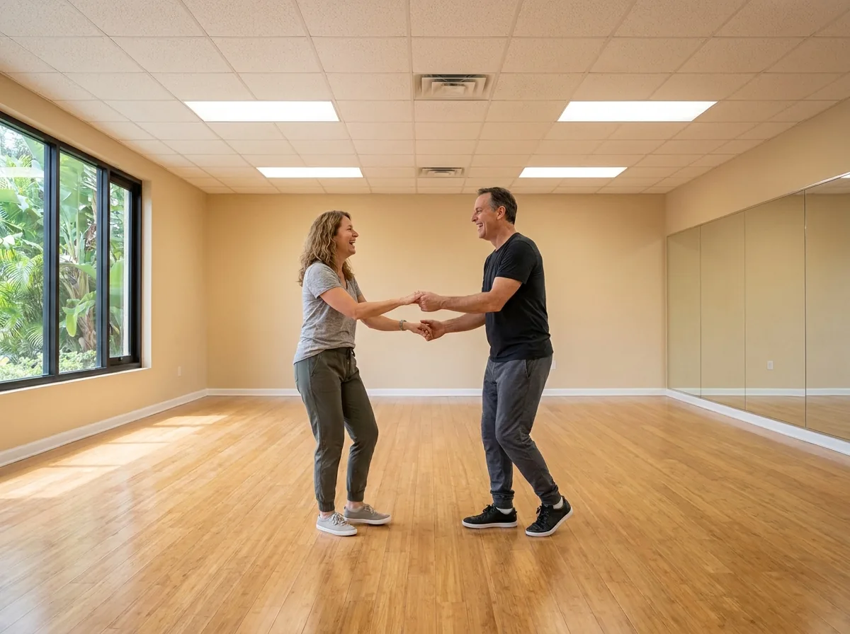 Instructor demonstrating east coast swing technique to a student in Solana Beach