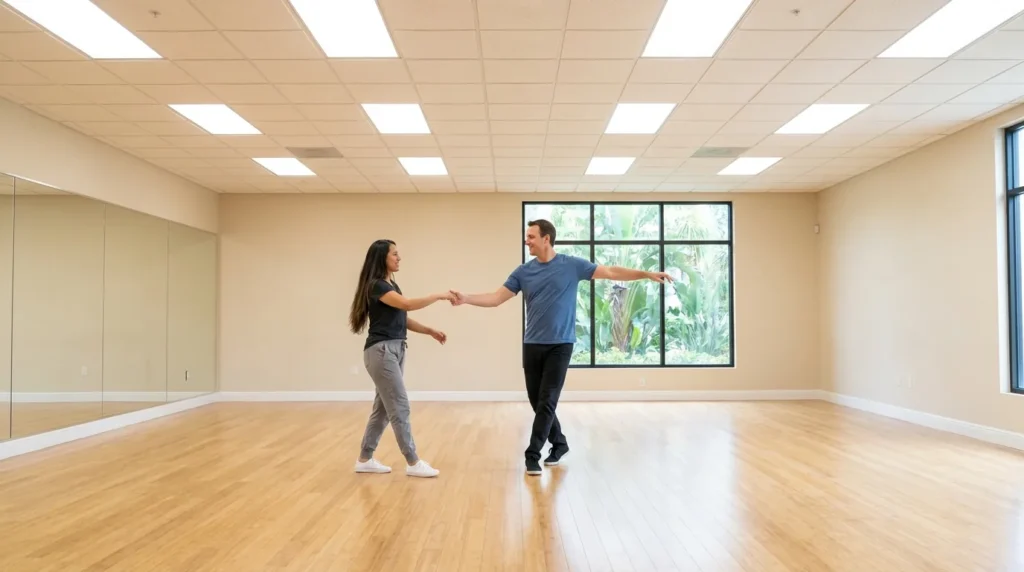 Couple dancing west coast swing in a Solana Beach studio