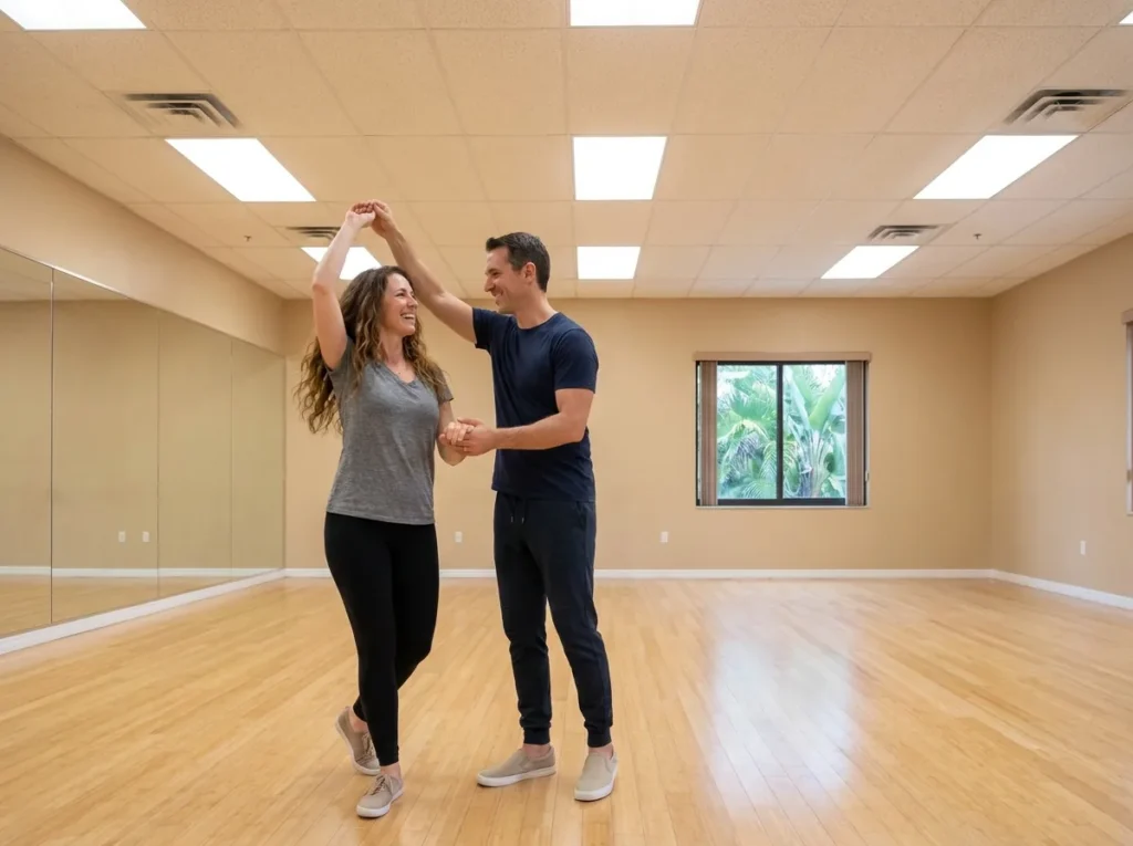 Nightclub dance lessons Solana Beach: a couple social dancing in a warm studio