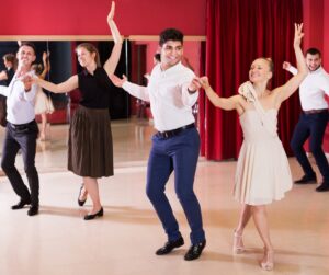 A couple dancing up a storm at Fred Astaire Dance Studios.