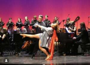 Michael, Professional Dance Instructor, Performing at the musical debut of Mad Hatter, the Musical, on stage in Montreal with one of his partners, Elizabeth