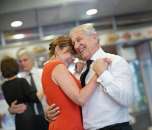 Couple Embracing To Holiday Ballroom Dancing